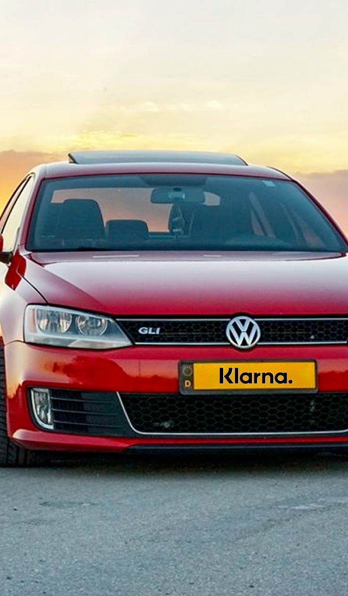 Volkswagen Golf lowered on Raceland Coilovers featuring a License Plate that reads Klarna